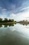 Dramatic sunrise on tranquil lake with reflections trees