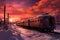 dramatic sunset behind the polar express train in winter