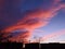 Dramatic Sunset Clouds Crossing Over A Fence Silhouette In The New Jersey Evening Sky