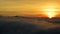 Dramatic sunset with dense fog above hills near Nitra city, western Slovakia.