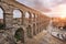 Dramatic sunset in famous Segovia aqueduct, Castilla y leon, Spain.