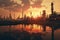 Dramatic sunset over industrial refinery mirrored in water