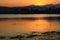 Dramatic sunset over the lake mountains and the sea with Fog of Kaeng Krachan Dam,Phetchaburi Province Thailand.