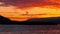 Dramatic sunset over ocean and mountains, Epic warm clouds in sky moving in timelapse, Iceland
