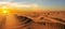Dramatic sunset over the wide sandy desert