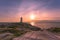 A dramatic sunset at Peggy\\\'s Cove Lighthouse Atlantic Coast Nova Scotia Canada.