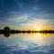 Dramatic sunset reflected in a quiet lake