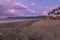 Dramatic sunset in Sabang Beach, Baler Aurora. Low angle view of outgoing tide