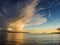 Dramatic sunset sky over Galway bay, Ireland, Blackrock diving board silhouette, Burren mountains, Atlantic ocean