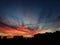 Dramatic sunset sky and the silhouetted buildings