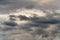 Dramatic thunderstorm clouds in dusk sky during rain. Amazing view of natural cloudiness weather background