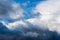 Dramatic thunderstorm clouds floating in blue sky before rain. Majestic cloudscape background