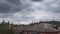 Dramatic thunderstorm clouds in the sky above the roof of the old big house