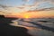 Dramatic Tropical Sunrise over Pacific Ocean and Sandy Beach