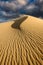 A dramatic vertical rippled dune landscape