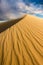 A dramatic vertical rippled dune landscape