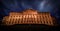 Dramatic view of the facade of the Neoclassical Wilhelmshohe castle at night in Kassel, Germany