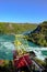 Dramatic view of the famous Niagara falls outlet, showing a cable car.