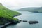 Dramatic view of green hills of Vagar island and Sorvagur town