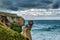 Dramatic view of high sandy cliffs at Tunnel beach, New Zealand