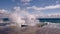 Dramatic view of sea waves crashing against the concrete pier