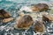 Dramatic view of stones or rocks washed by the turquoise sea water.