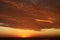 Dramatic Volcanic Crimson Sunset over Pacific Ocean