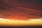 Dramatic Volcanic Crimson Sunset over Pacific Ocean