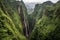 dramatic waterfall along steep mountain trek