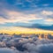 Dramatic white clouds and blue sky from airplane window view Colorful sunset cloudscape background.