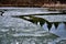 Dramatic wide-angle view of  breaking up of ice surface at the pond