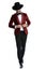 Dramatic young man in red velvet tuxedo adjusting coat