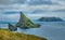 Drangarnir iconic gate and Mykines island in the background