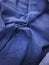 draped blue fabric with a small pattern as the background
