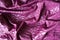 Draped glossy purple viscose fabric from above