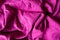 Draped magenta colored plain linen fabric