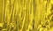 Draped velvet fabric trendy lighting golden yellow 2021. Abstract background