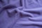 Draped violet fleece fabric from above
