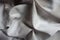 Draped viscose and polyester fabric with tie-dye pattern in shades of gray