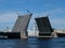 Drawbridge in St. Petersburg, Russia. The Kunstkamera building between the openings of the bridge