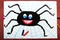 Drawing: Black happy spider and spider`s web