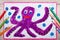 Drawing and crayons: Smiling cute octopus