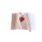 The drawing of the heart are on rough crumpled paper. The sheet is torn in half. The symbol of a break in relations, divorce