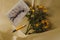 A drawing in a notebook and a fading bouquet of yellow roses