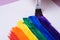 Drawing rainbow, rainbow stripes with watercolor paint using brush, closeup, lgbtq symbol