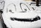 Drawing smiley face on the snow-covered car