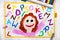 drawing: Smiling girl and colorful alphabet letters