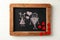 Drawn couple with hearts on small chalkboard