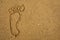 Drawn footprint on sand.