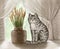 drawn gray cute cartoon tabby cat sitting on a windowsill near a vase of flowers